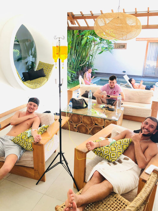 Client smiling during IV drip session at Sanur Bali hotel