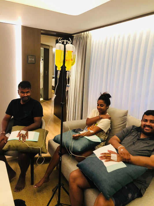 Client receiving IV drip at Sanur Bali hotel room early morning